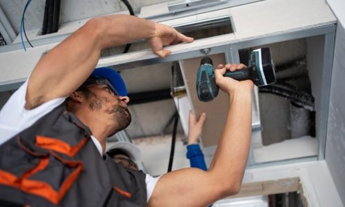 low-angle-people-working-with-drill_23-2149366670